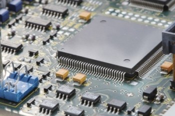Close-up of electronic circuit board with processor. Image courtesy of koko-tewan at FreeDigitalPhotos.net