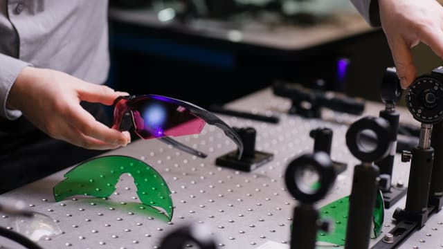 A LazrBloc laser lens undergoes quality testing at Revision's lab. (Image courtesy of Revision Military.)